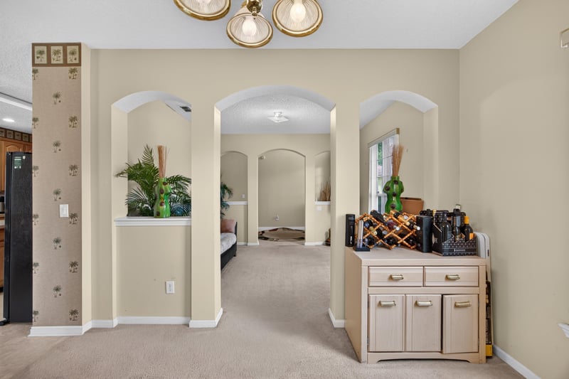 Formal living room with decorative niche at 2875 Pebblewood Ln, Orange Park, FL 32065