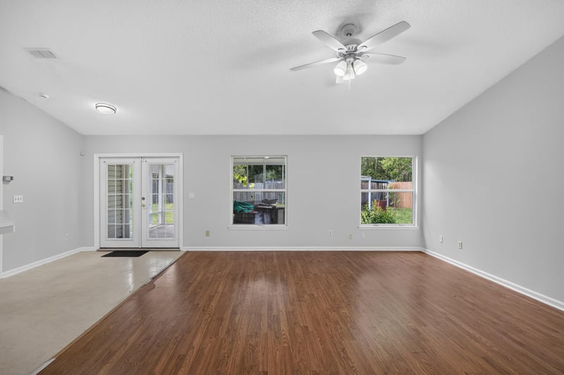 Living room with french doors to backyard at 9691 Nelson Forks Dr, Jacksonville, FL 32222