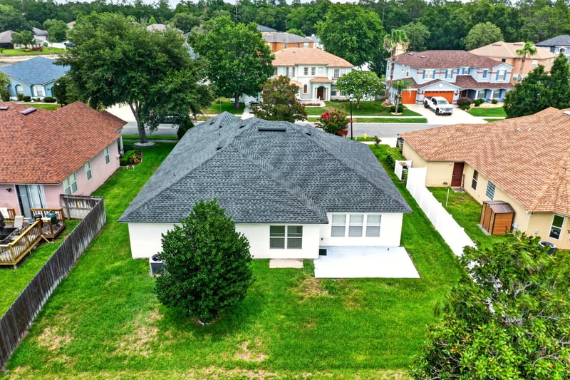 Aerial backyard view with neighboring homes in Adams Lake, Jacksonville, FL