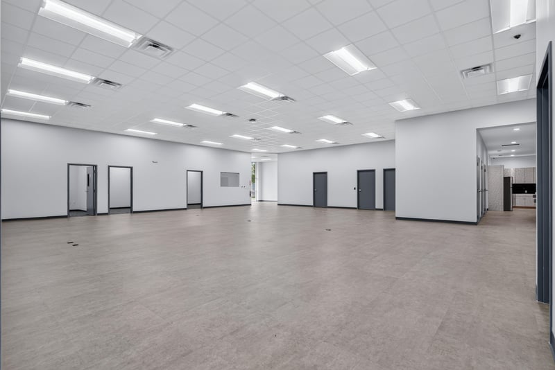 Open space with multiple interior doors and drop ceiling at 7240 Golden Wings Rd building 100, Jacksonville, FL 32244