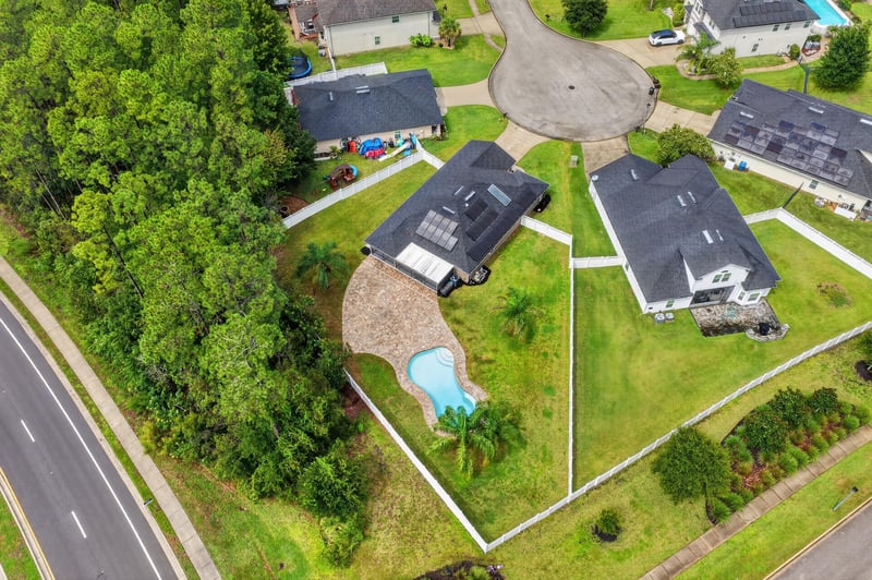 Aerial view of two homes and pool in Sutherland Forest, St. Johns, FL