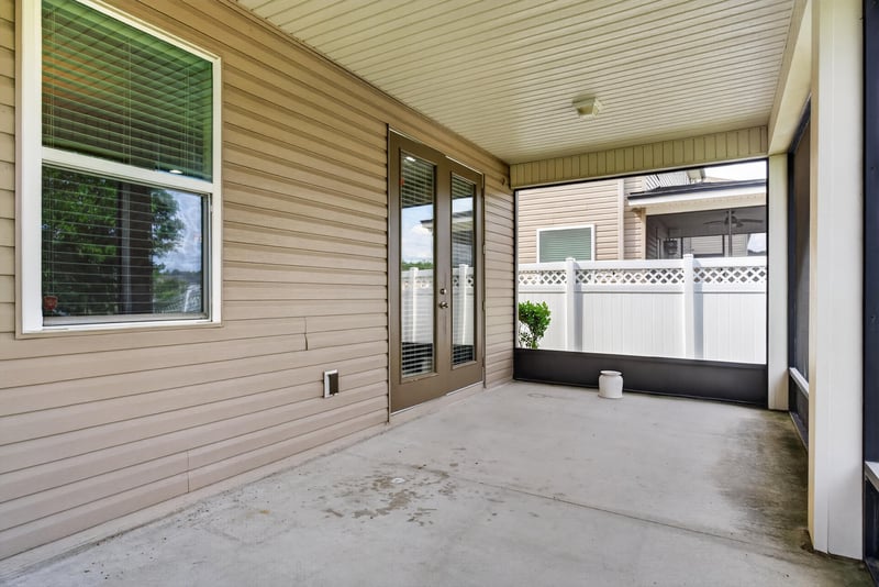 Covered patio with screened enclosure at 263 Gilmore Ln, Orange Park, FL 32065