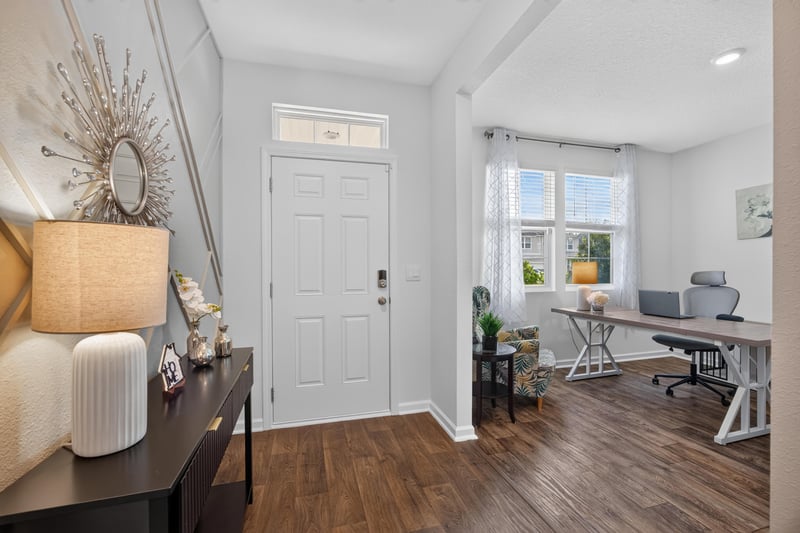 Foyer with front door and view into office at 65255 Frst Glen Ln, Yulee, FL 32097