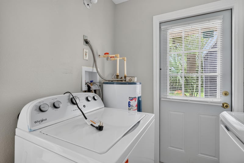 Laundry area with washer, dryer and water heater at 255 Woodside Dr, Orange Park, FL 32073