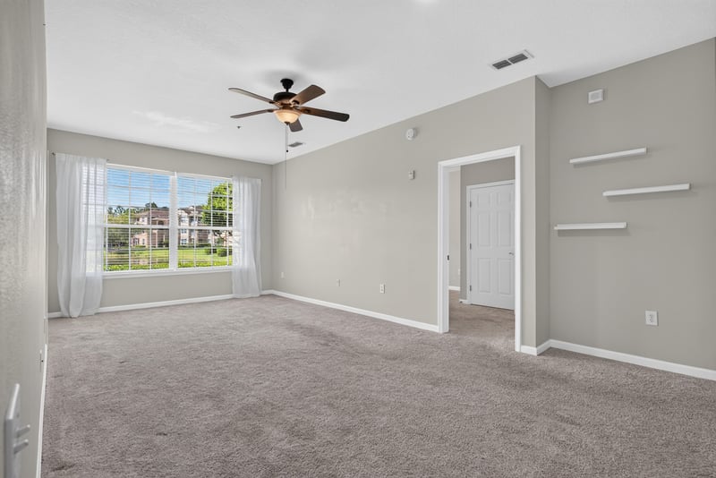 Living area with ceiling fan and carpet at 7990 Baymeadows Rd E #404, Jacksonville, FL 32256