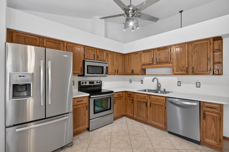 Kitchen with stainless steel appliances and oak cabinets at 2460 San Sago Ln, Jacksonville, FL
