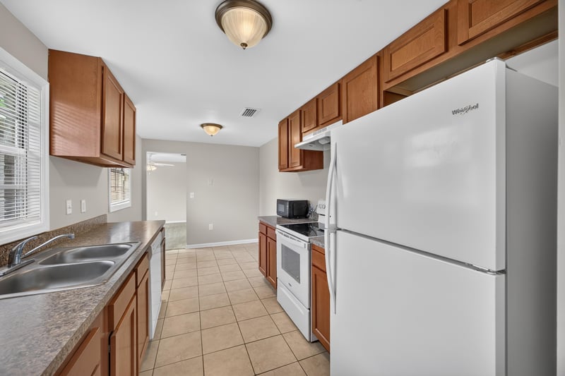 Kitchen with refrigerator and sink at 1143 Tumbleweed Dr, Orange Park, FL 32065