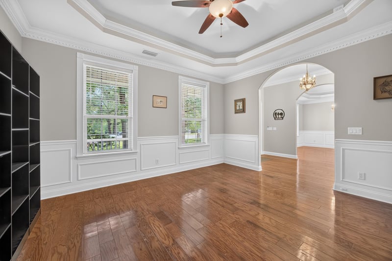 Living room with bay window and arched entry at 1735 Hagans Ridge Ct