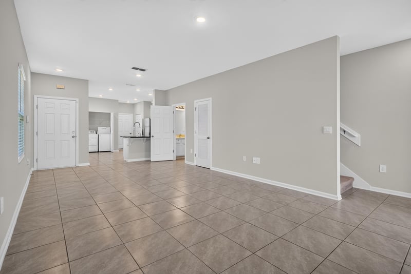 Open living and dining space from kitchen doorway at 4024 Bay Hawk Ct, Jacksonville, FL