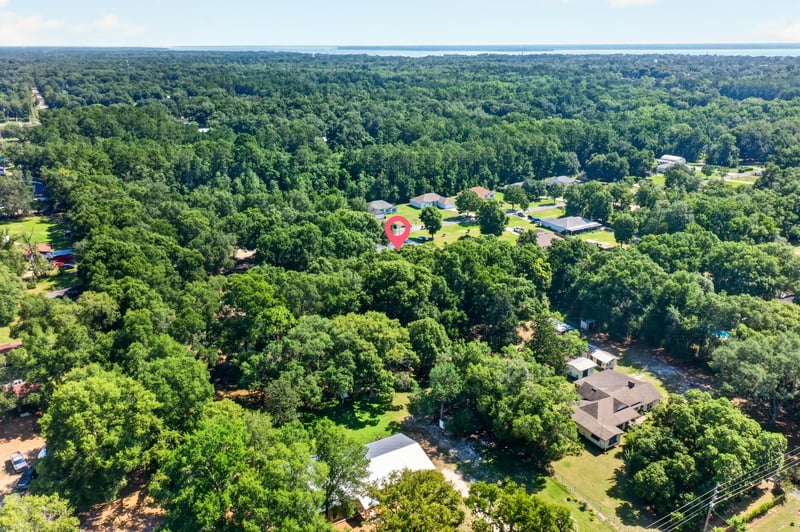 Aerial view of the property marked among wooded lots at 1735 Hagans Ridge Ct