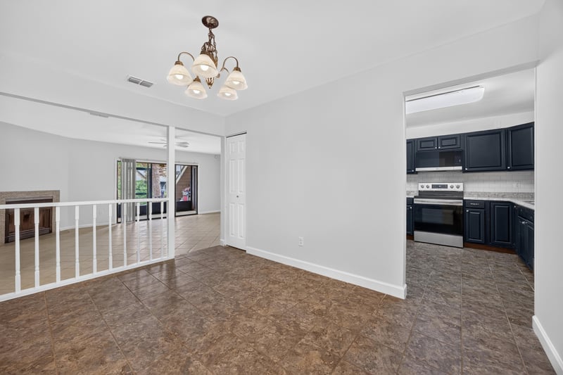 Loft area with railing and wood-look floor at 3801 Crown Point Rd unit 2061, Jacksonville, FL 32257