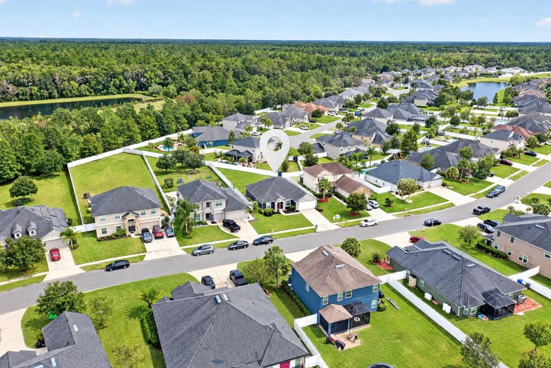 Aerial view of neighborhood streets and rooftops in Murabella