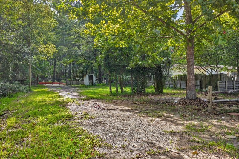 Dirt driveway leading toward the home at 55520 Jewel-Thomas Rd, Callahan, FL 32011
