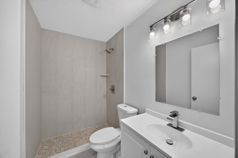 Bathroom with stall shower and vanity at 8047 Mactavish Way E, Jacksonville, FL 32244