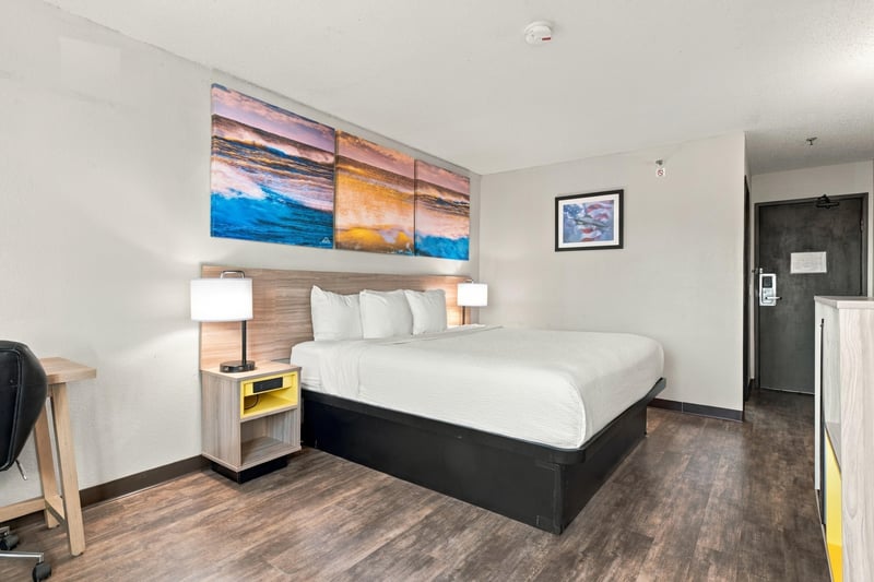 Guest room with bed and artwork, photographed by Megapixeler on Eldridge Loop, Orange Park