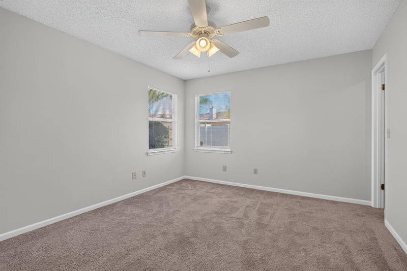 Bathroom with glass shower, soaking tub and arched window at 400 Ashcroft Landing Dr, Jacksonville, FL 32225