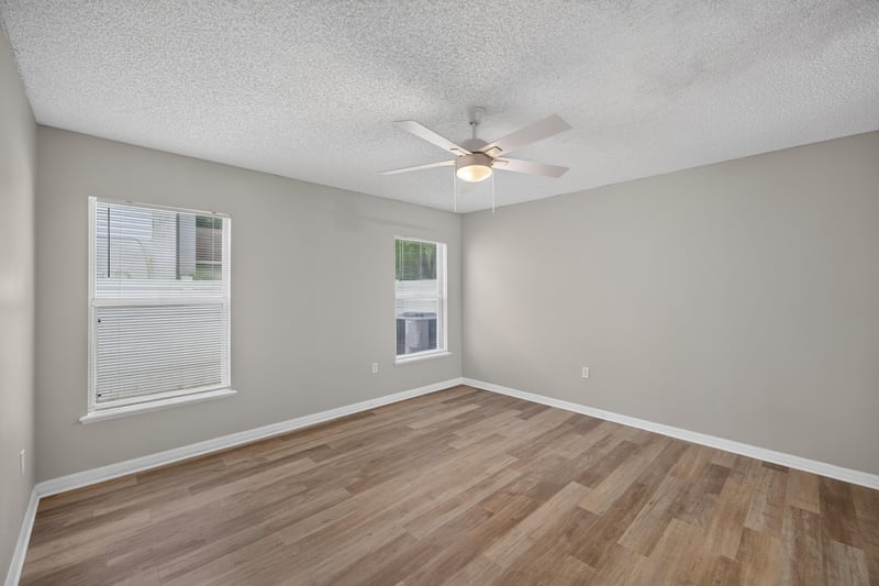 Bedroom with ceiling fan and window at 1845 Saga Ct, Middleburg, FL