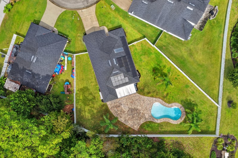 Aerial view of two homes and pool in Sutherland Forest, St. Johns, FL