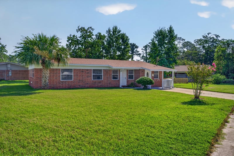 Front exterior, brick ranch home and lawn at 5503 Boeing Dr, Jacksonville, FL 32207