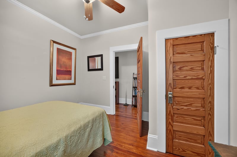 Bedroom with a gold bedspread and windows at 1555 Belmonte Ave, Jacksonville, FL 32207
