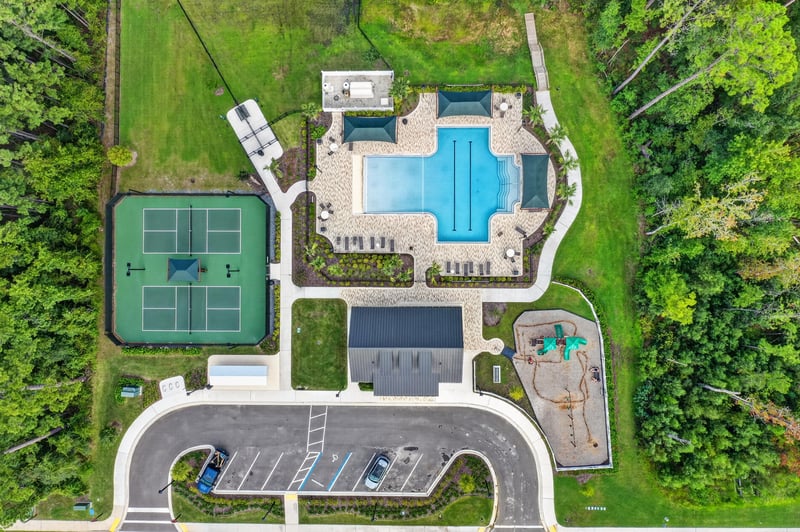 Aerial view of the clubhouse pool and courts in Middleburg, FL