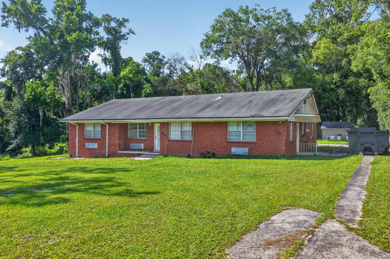 Front exterior view of brick ranch home at 5745 110th St, Jacksonville, FL 32244