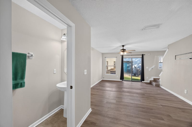 Hallway with sink and view toward living area at 7723 Playschool Ln, Jacksonville, FL