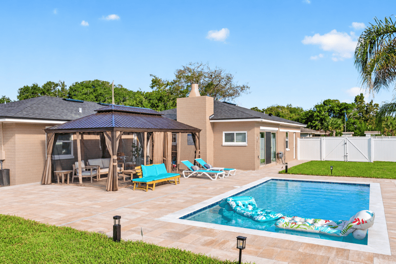 Backyard pool and screened gazebo at 1525 8th St N, Jacksonville Beach, FL