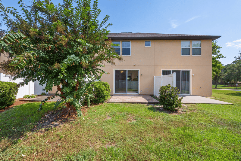 Rear exterior view with patio at 3762 Hartsfield Forest Cir, Jacksonville, FL 32277
