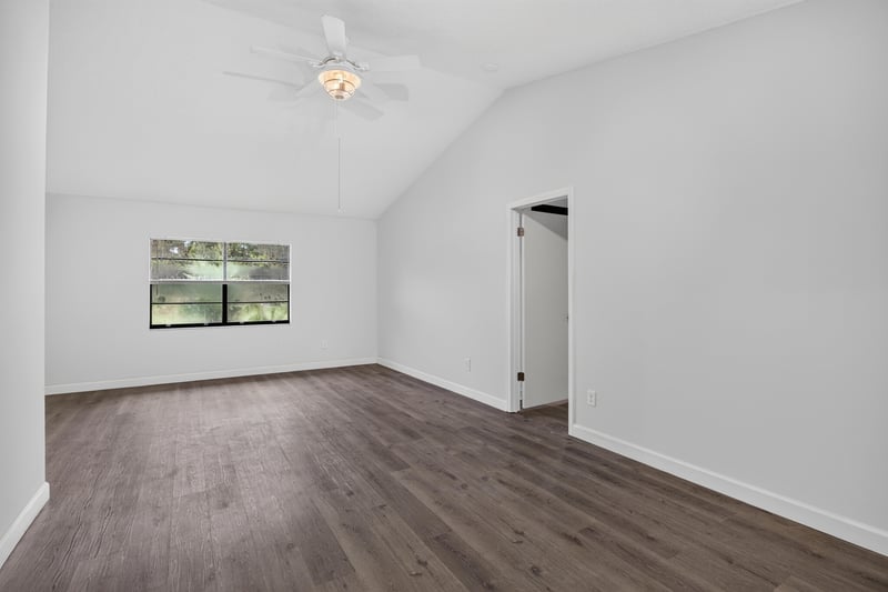 Living area with vaulted ceiling and window at 551 Deltona Blvd, St. Augustine, FL 32086