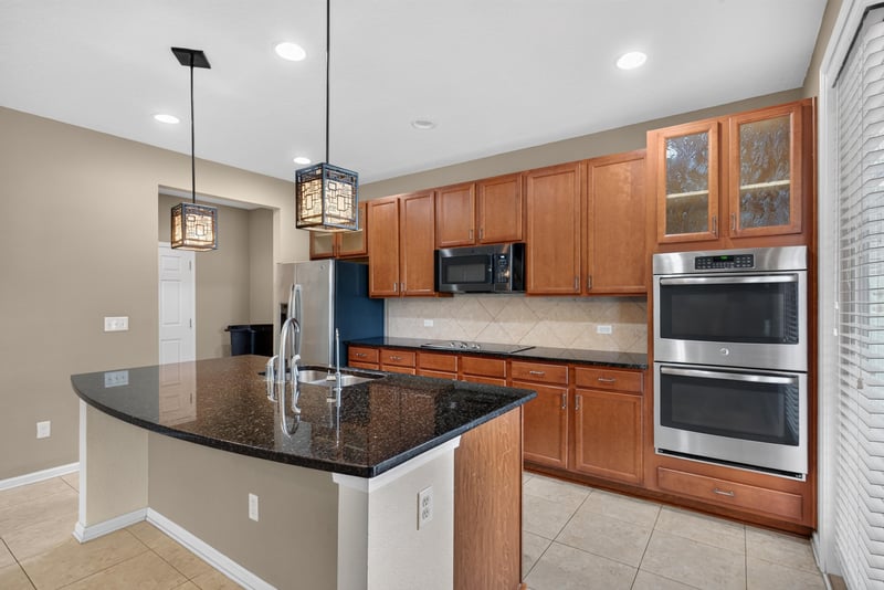 Kitchen island with stainless double oven and pendant lights at 263 Gilmore Ln, Orange Park, FL 32065
