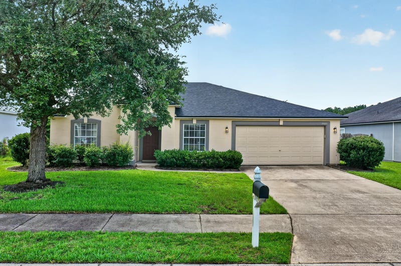 Front exterior with mailbox and driveway at 2065 Creekmont Dr