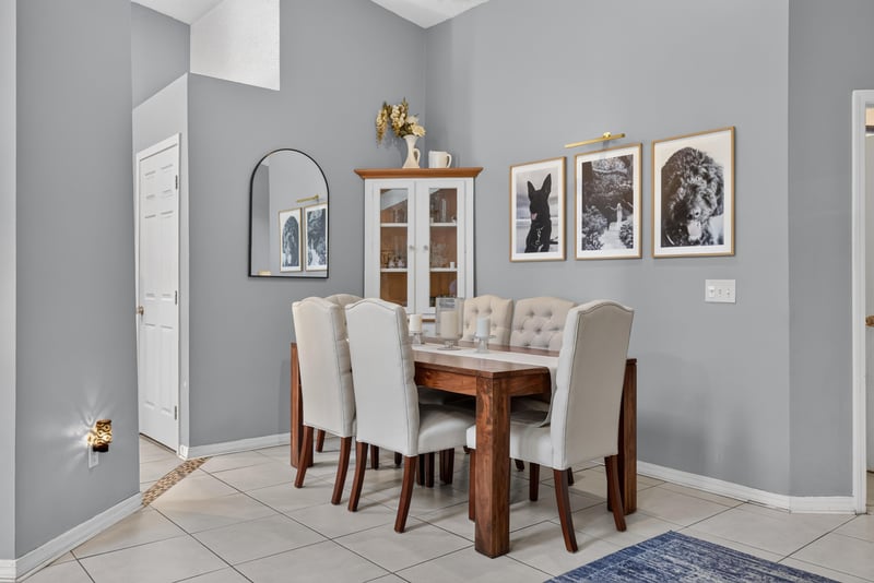 Dining area with table and upholstered chairs at 13020 Medford Ln, Jacksonville, FL 32225