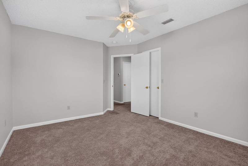Bedroom with ceiling fan and closet at 400 Ashcroft Landing Dr, Jacksonville, FL 32225