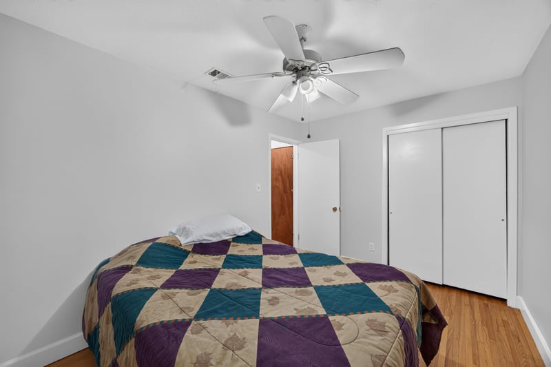 Bedroom with closet doors and ceiling fan at 1847 Grove Park Dr, Orange Park, FL