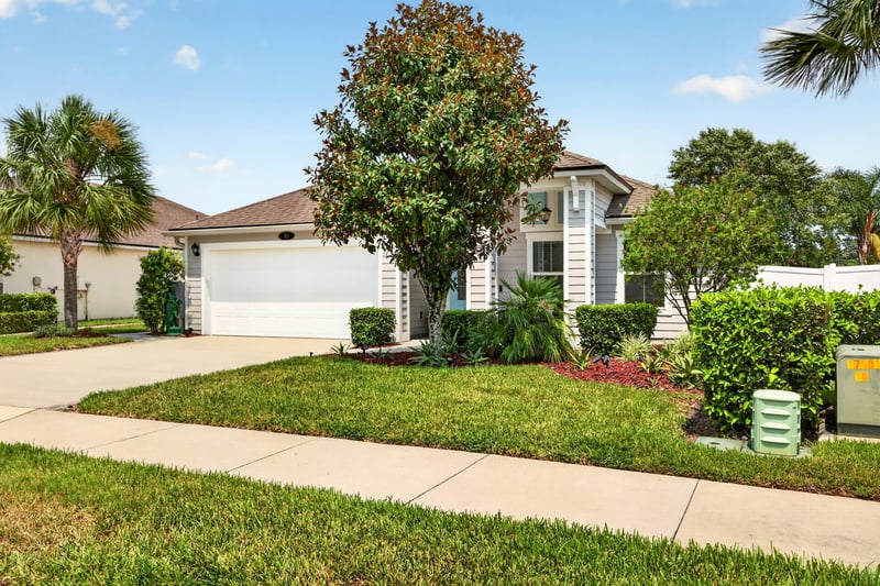 Front exterior with landscaped beds and walkway at 85 Amia Dr, St. Augustine, FL 32086