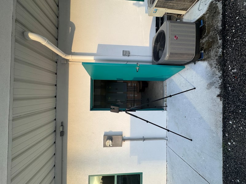 Rooftop condenser unit near access door at 11700 New Kings Rd, Jacksonville, FL 32219