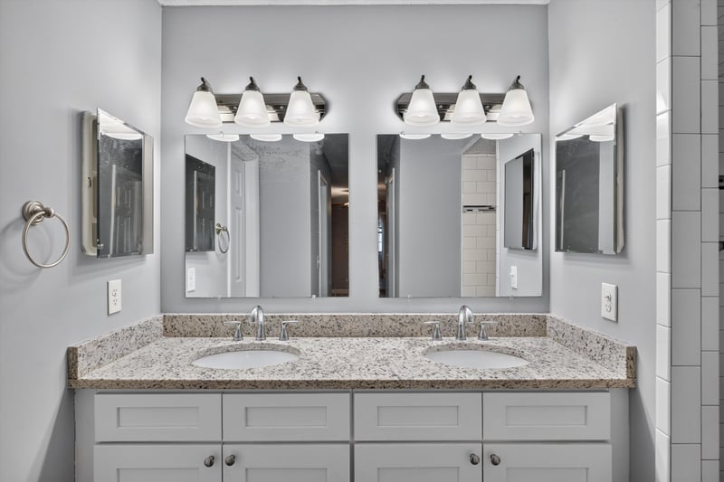 Bathroom with double vanity and mirrors at 12344 Cormorant Ct, Jacksonville, FL