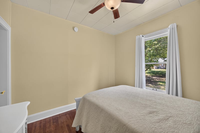 Bedroom with bed near window at 101 N Lake St, Crescent City, FL