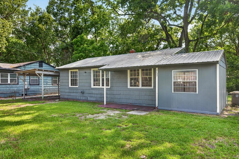 Front view of home with white trim windows at 2132 Allandale Cir W, Jacksonville, FL