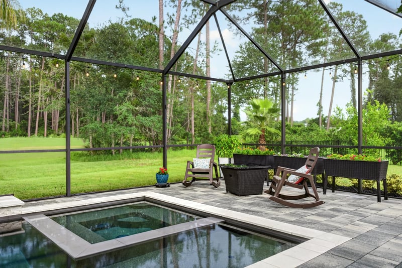 Spa and screened lanai with wooded view at 2304 Spring Hill Ct, Orange Park, FL