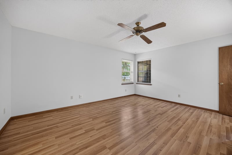 Empty bedroom with wood floor and window at 2460 San Sago Ln, Jacksonville, FL