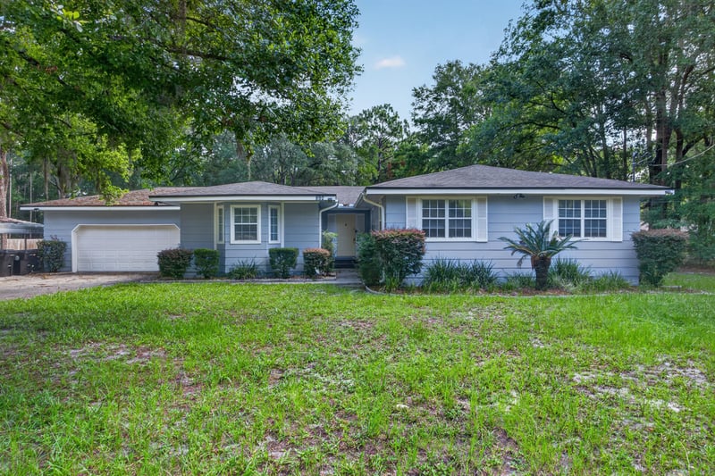 Front exterior of ranch home with large front lawn at 892 Branscomb Rd, Green Cove Springs, FL