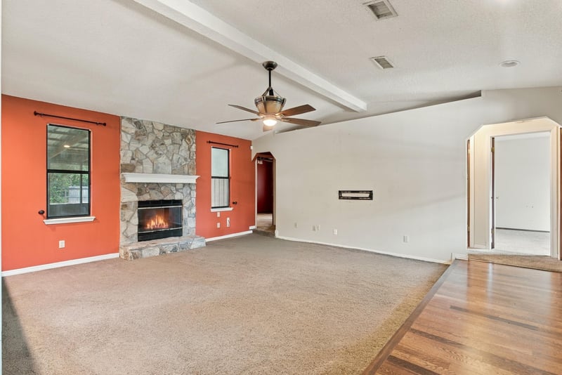 Living room with carpet and wood flooring and ceiling fan at 2915 Trenton Ct, Orange Park, FL