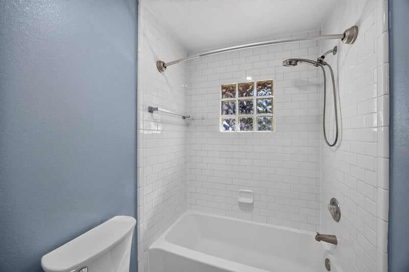 Bathroom with tiled tub-shower combination at 10150 Belle Rive Blvd, Jacksonville, FL