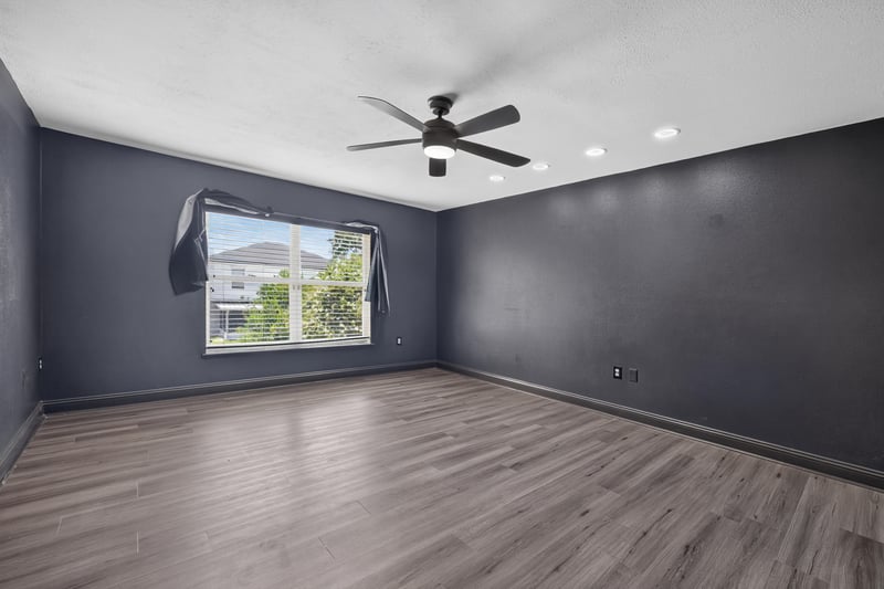 Bedroom with gray walls and wood-look floor at 3428 Glenn Hollow Ct, Jacksonville, FL 32226