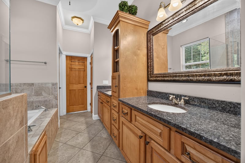 Primary bath vanity with granite counters at 1735 Hagans Ridge Ct