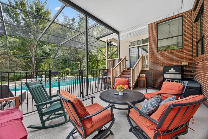 Screened pool area with lounge seating at 2125 Blue Heron Cove Dr, Orange Park, FL 32003