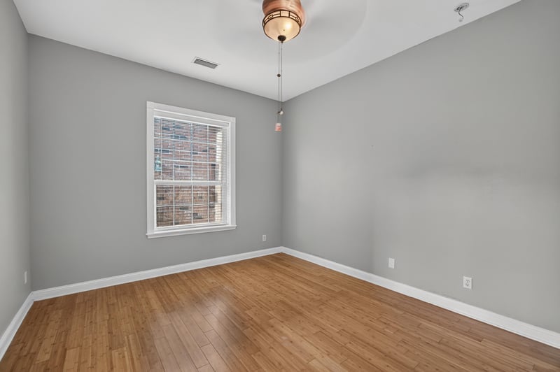 Bedroom with hardwood floors and natural light at 1735 Hagans Ridge Ct