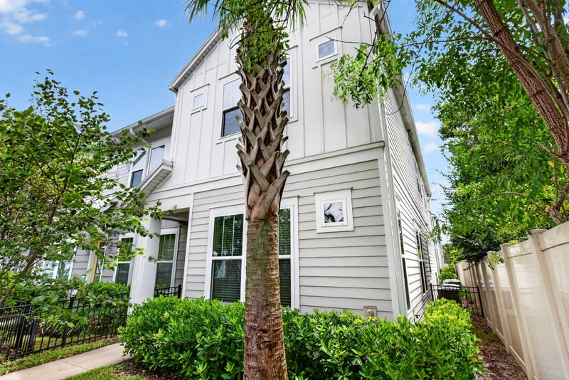 Upper front exterior with gray siding at 7446 Loggerhead Ct, Jacksonville, FL 32256